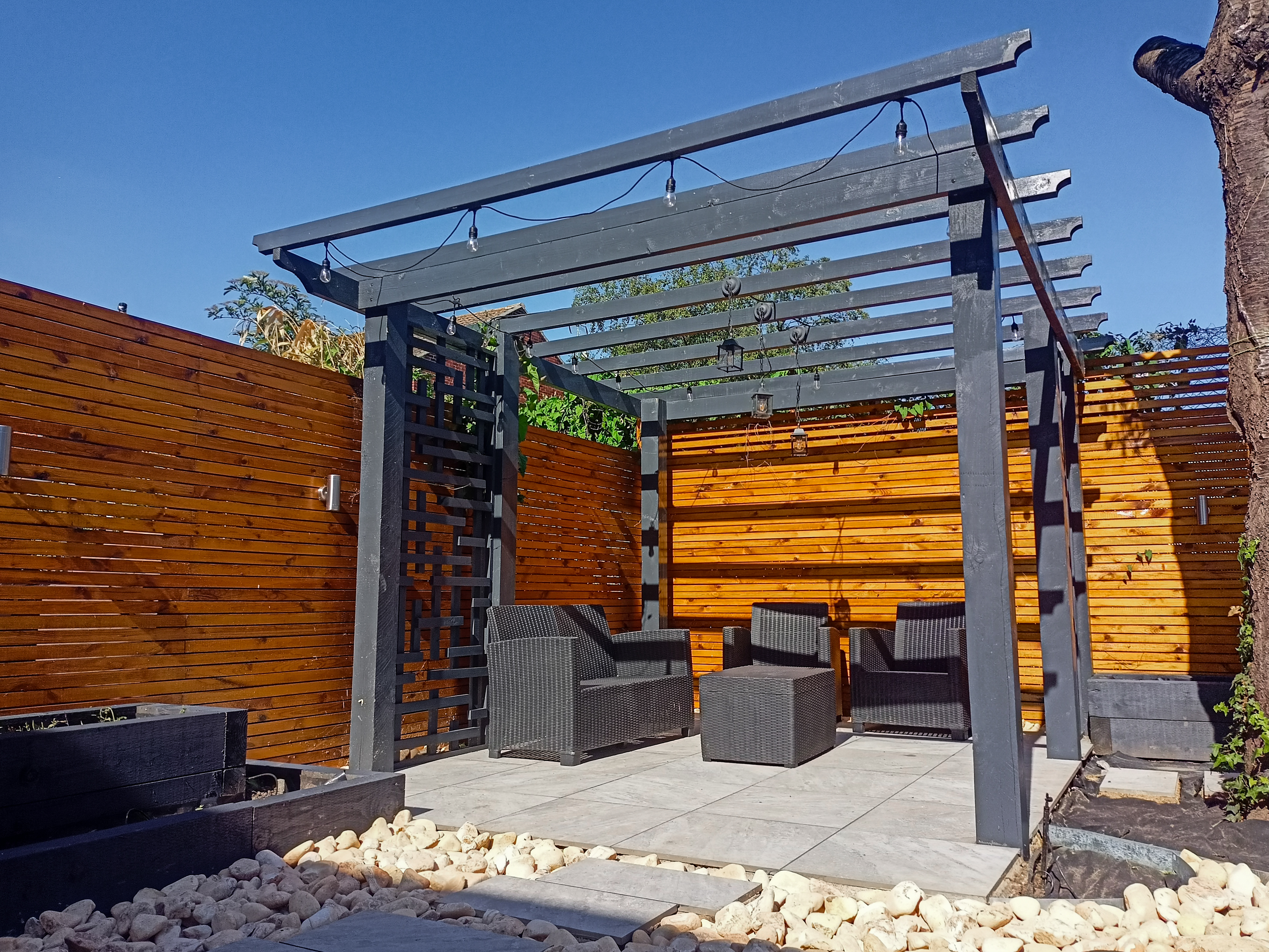 Custom designed pergolas adding architectural interest and shade to enhance outdoor garden spaces