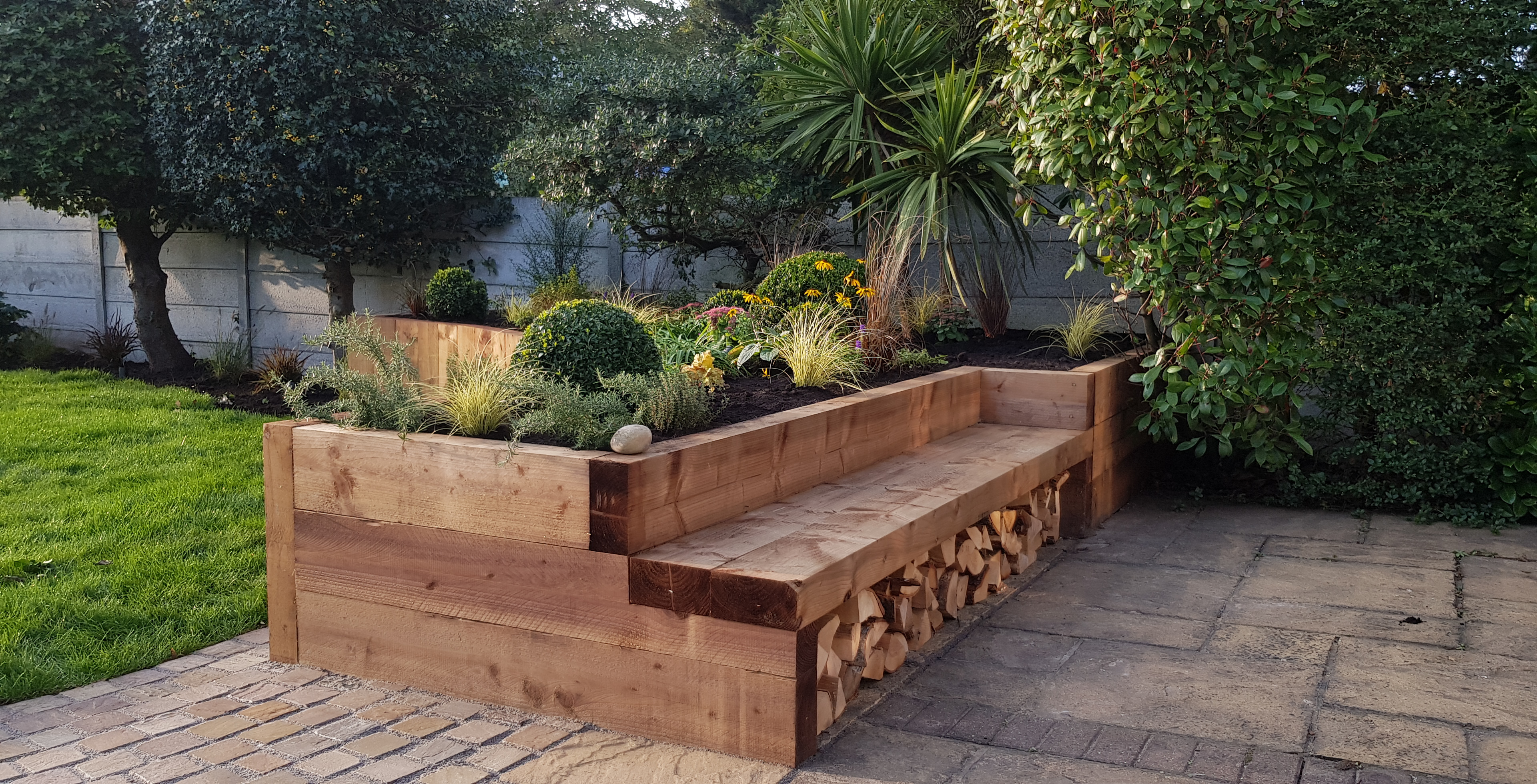 Vibrant flower bed design and installation bringing year-round colour and life to gardens